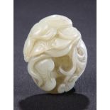 A CHINESE CELADON JADE CARVING