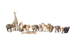 A COLLECTION OF TWELVE PAINTED IVORY MINIATURE ANIMAL MODELS