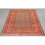 A TRIBAL PERSIAN CARPET. 289cm by 202cm