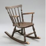 A 19TH CENTURY PAINTED AND SIMULATED ROSEWOOD CHILD'S ROCKING CHAIR