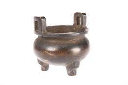 A CHINESE BRONZE TRIPOD CENSER, IN THE ARCHAIC STYLE