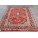 A LARGE PERSIAN HAND-KNOTTED CARPET. 342cm by 245cm