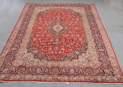 A LARGE PERSIAN HAND-KNOTTED CARPET. 342cm by 245cm