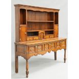 A GEORGE III OAK DRESSER AND RACK