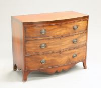 AN EARLY 19TH CENTURY MAHOGANY BOW-FRONT CHEST OF DRAWERS