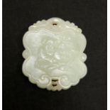 A CHINESE CELADON JADE PENDANT