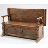 A LATE VICTORIAN OAK MONKS BENCH