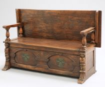 A LATE VICTORIAN OAK MONKS BENCH