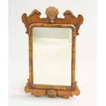 A PARCEL-GILT WALNUT FRETWORK MIRROR, IN GEORGE II STYLE