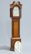 A GEORGE III OAK AND MAHOGANY LONGCASE CLOCK