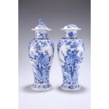 A PAIR OF CHINESE BLUE AND WHITE PORCELAIN VASES AND COVERS