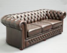A PAIR OF BROWN LEATHER CHESTERFIELD THREE-SEATER SOFAS