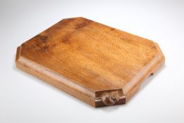 A MOUSEMAN OAK CHOPPING BOARD OF SUBSTANTIAL PROPORTIONS