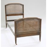 A PAIR OF HARROD'S OAK AND CANEWORK BEDS