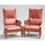 A PAIR OF VICTORIAN OAK AND LEATHER LIBRARY ARMCHAIRS
