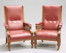 A PAIR OF VICTORIAN OAK AND LEATHER LIBRARY ARMCHAIRS