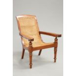 AN INDONESIAN TEAK AND BERGERE CANED PLANTER'S CHAIR
