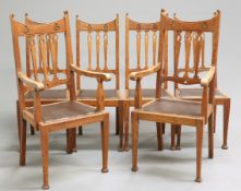 A SET OF SIX ARTS AND CRAFTS OAK DINING CHAIRS