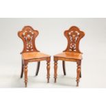 A PAIR OF VICTORIAN MAHOGANY HALL CHAIRS