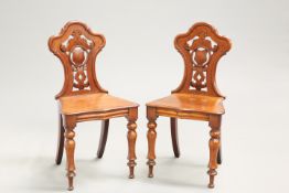 A PAIR OF VICTORIAN MAHOGANY HALL CHAIRS