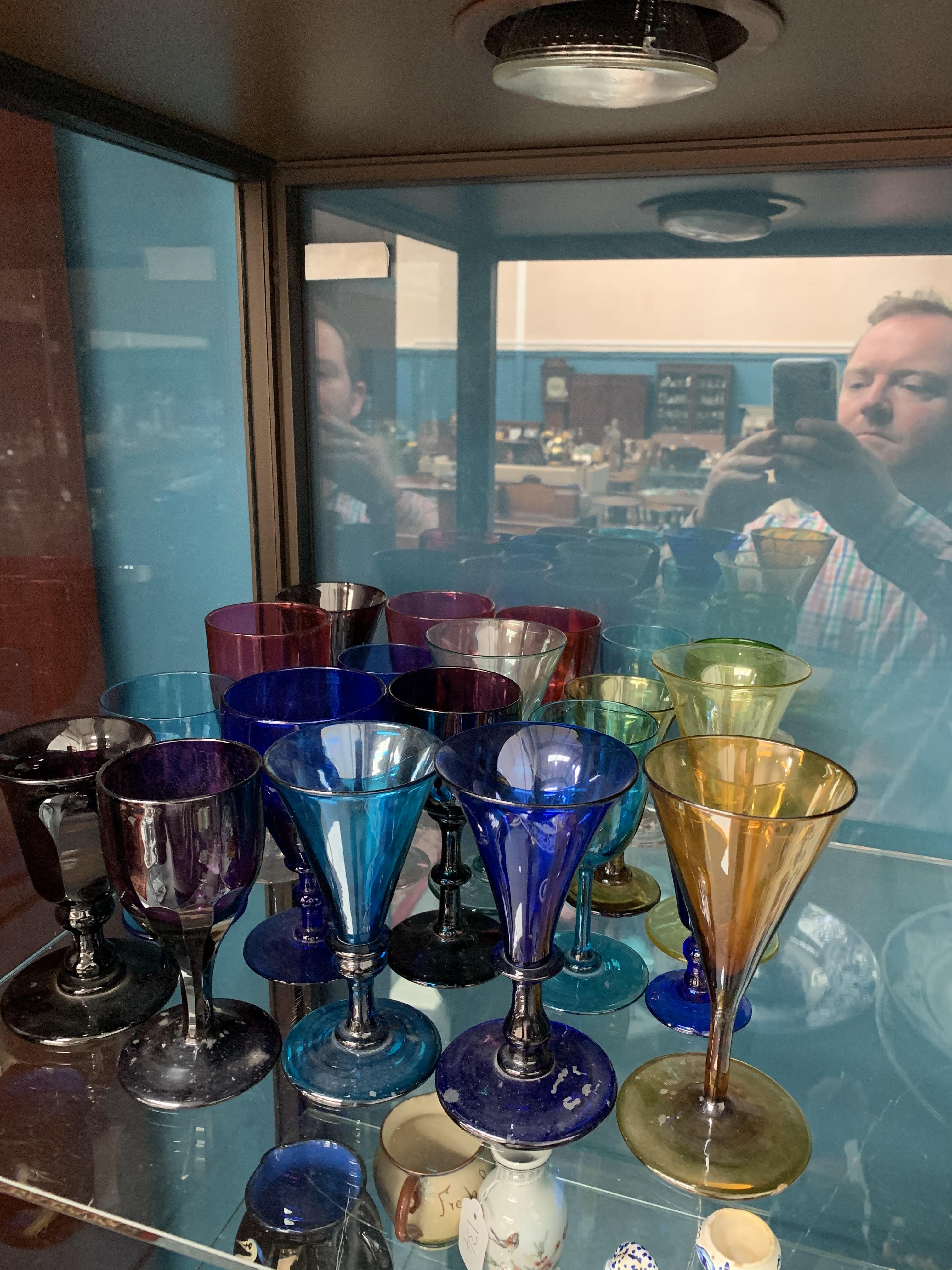 A COLLECTION OF TWENTY VICTORIAN WINE GLASSES, various colours, including amethyst, blue and cranber