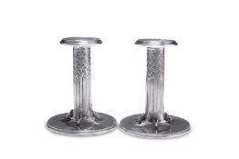 A PAIR OF LIBERTY & CO PEWTER CANDLESTICKS, NOS. 022