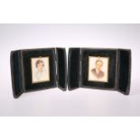 A PAIR OF LEATHER CASED PORTRAIT MINIATURES ON IVORY