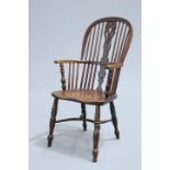 AN EARLY 19TH CENTURY YEW AND ELM WINDSOR CHAIR