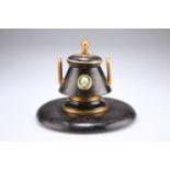 A REGENCY PATINATED AND GILDED BRONZE INKWELL