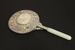 A CHINESE WHITE-METAL AND JADE HAND MIRROR