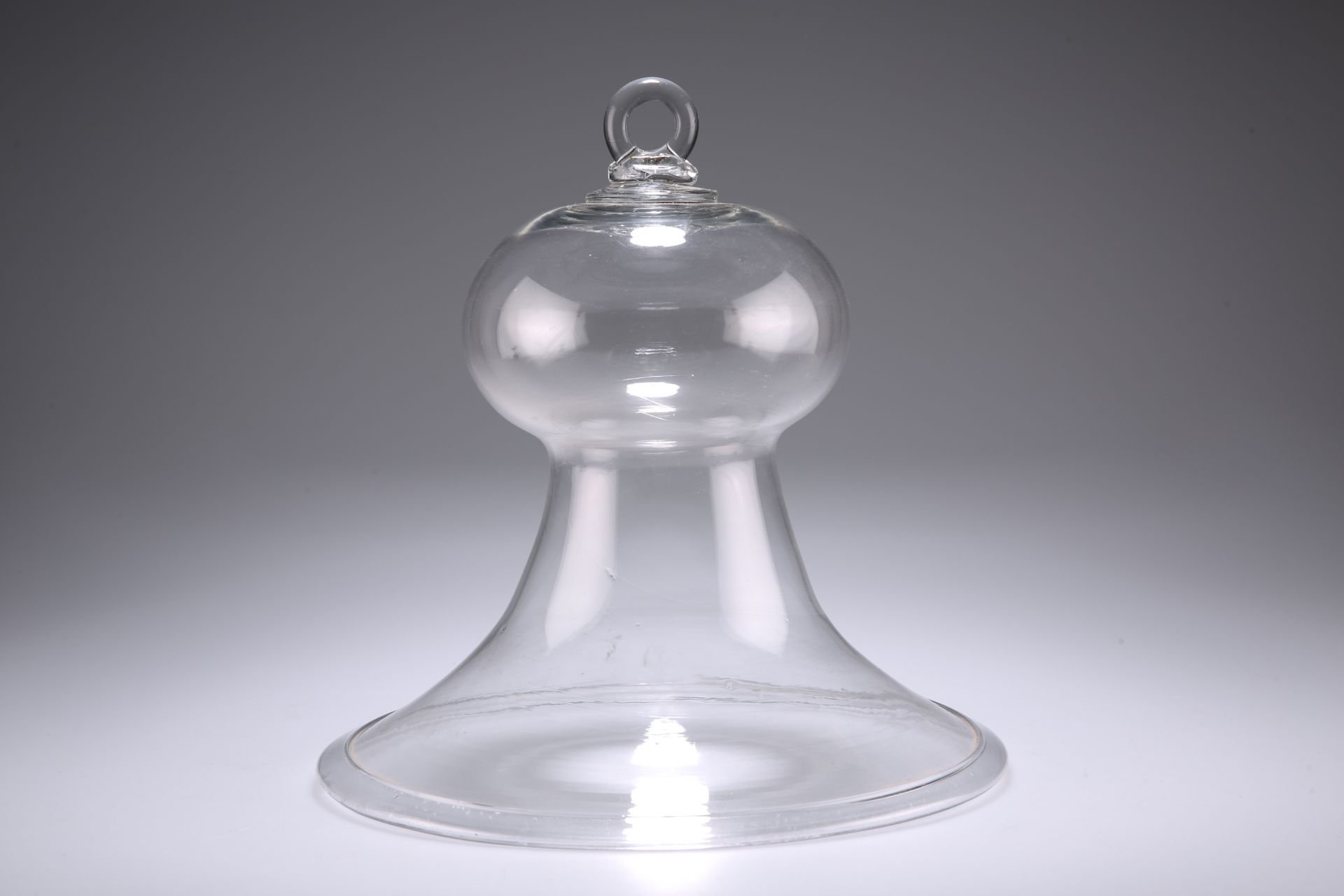A 19TH CENTURY GLASS SMOKE BELL, with folded rim. 24.5cm high