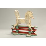 AN EDWARDIAN PAINTED WOODEN ROCKING HORSE