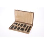 A BOXED SET OF TEN CHINESE CARVED INK STONES, various sizes.