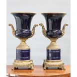 A LARGE PAIR OF GILT-METAL MOUNTED BLUE-GLAZED URNS