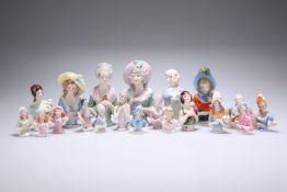 A COLLECTION OF TWENTY CONTINENTAL PORCELAIN PIN-CUSHION DOLLS.