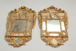 A HANDSOME PAIR OF BAROQUE REVIVAL GILTWOOD MIRRORS