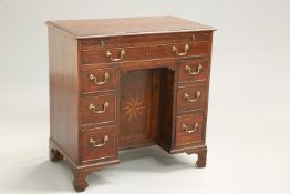 A GEORGE III OAK KNEEHOLE DESK