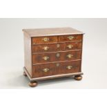 A WILLIAM AND MARY OYSTER VENEERED CHEST OF DRAWERS