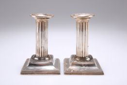 A PAIR OF VICTORIAN SILVER CANDLESTICKS