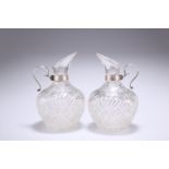 A PAIR OF VICTORIAN SILVER-MOUNTED CUT-GLASS JUGS