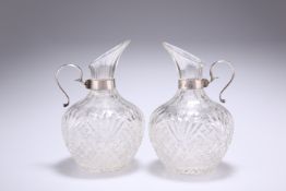 A PAIR OF VICTORIAN SILVER-MOUNTED CUT-GLASS JUGS