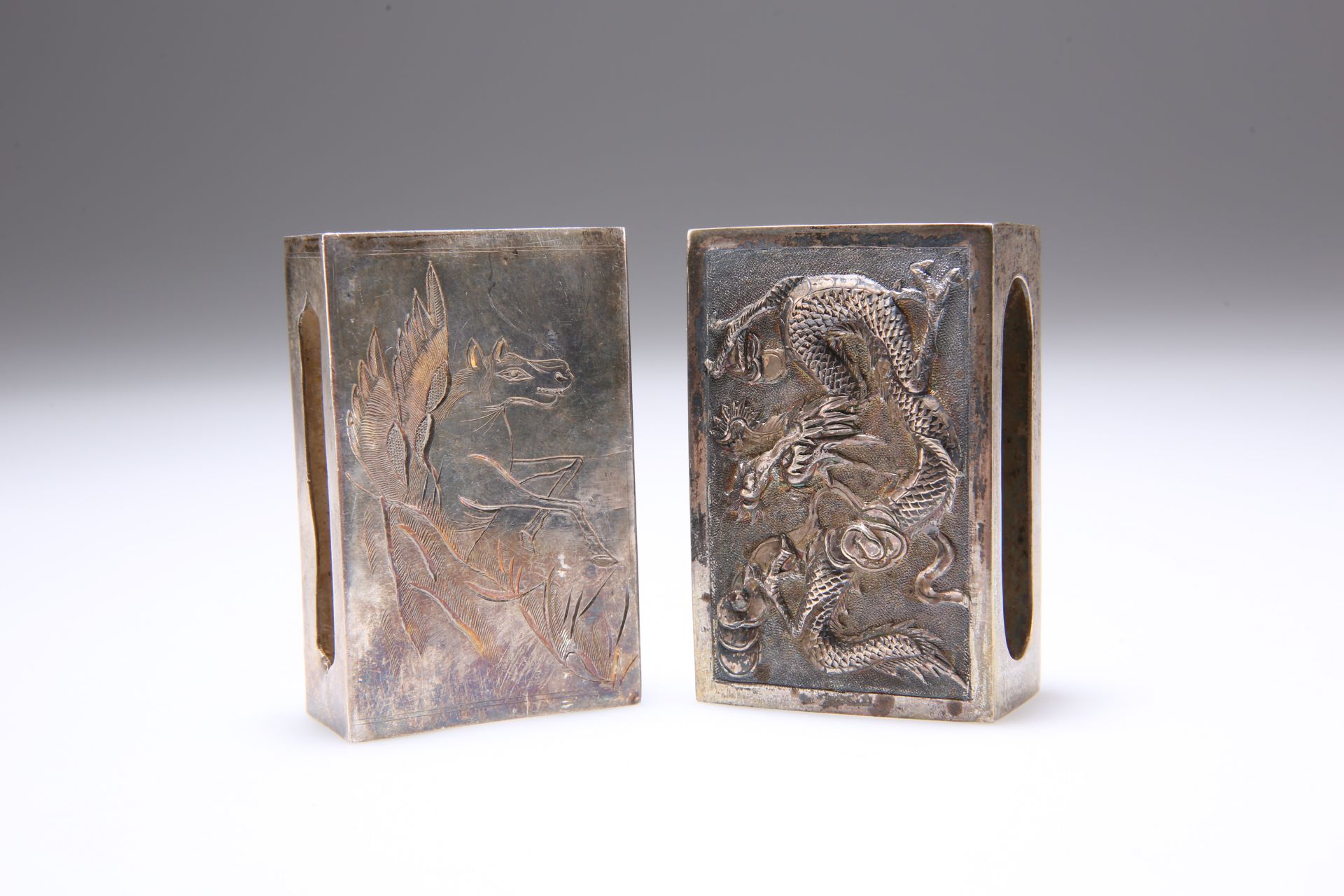 TWO CHINESE SILVER MATCHBOX SLEEVES