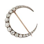 A DIAMOND CRESCENT BROOCH