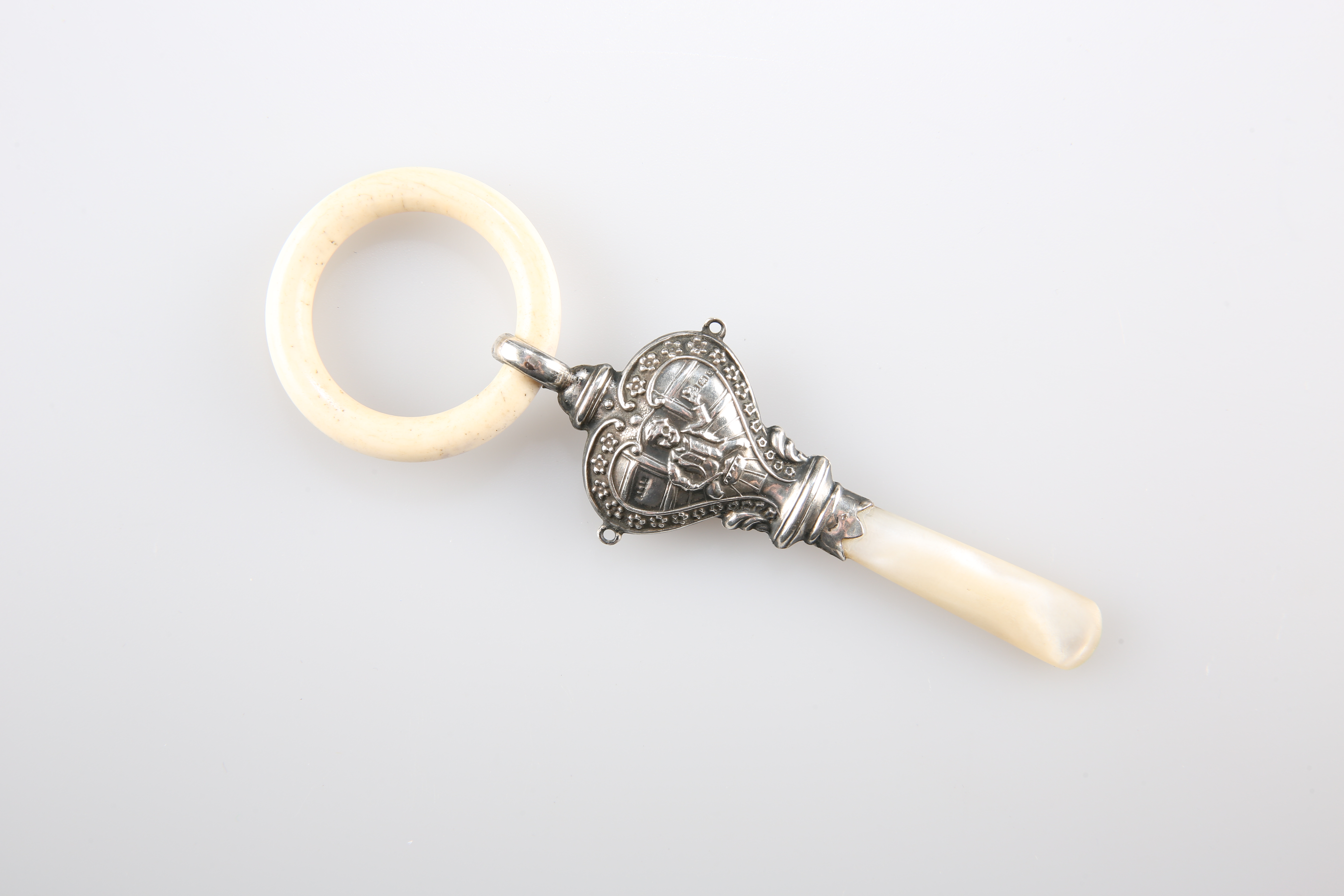 A GEORGE V SILVER AND MOTHER-OF-PEARL "LITTLE JACK HORNER" TEETHER