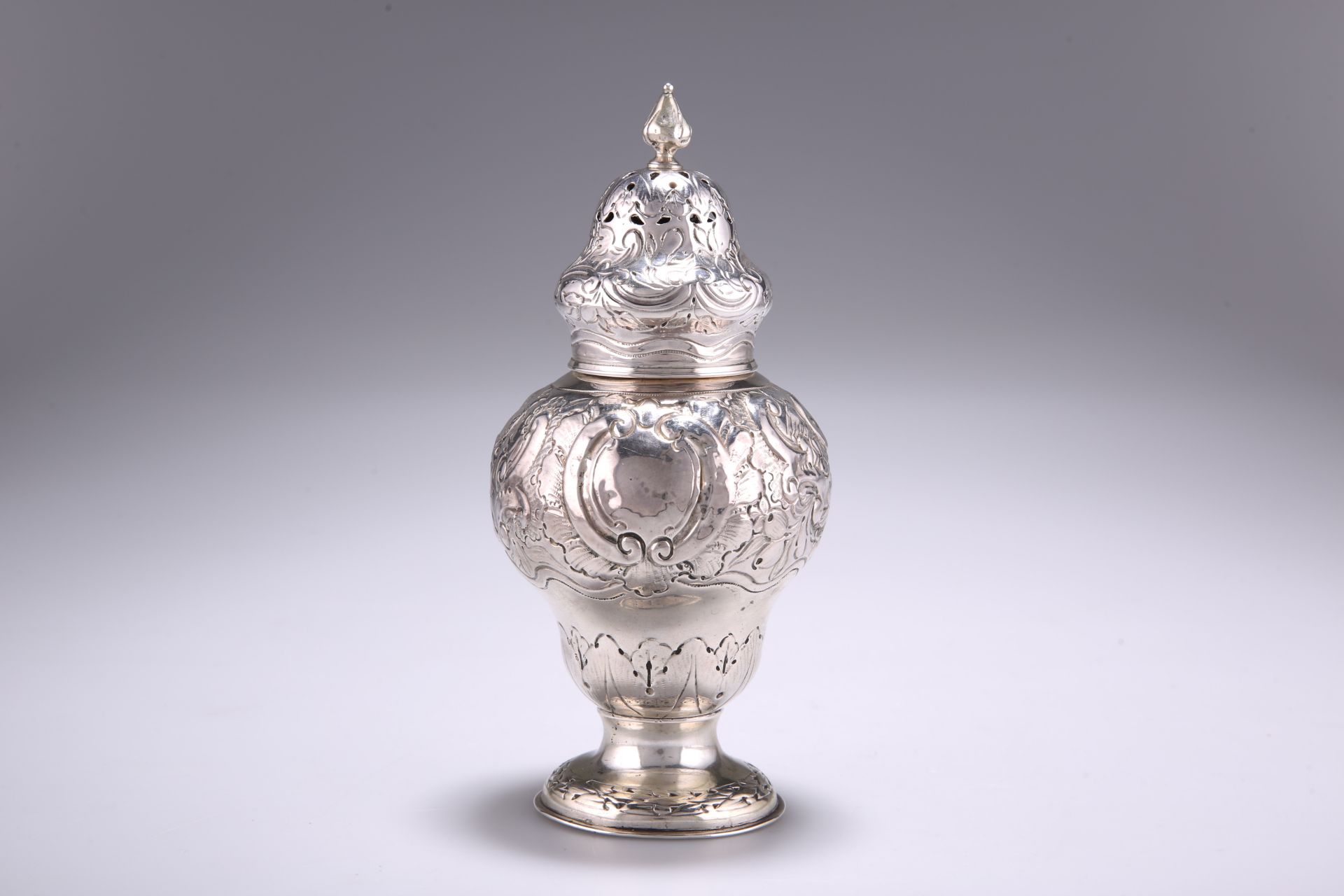 AN INDIAN COLONIAL SILVER CASTER