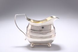 A GEORGE III SILVER CREAM JUG