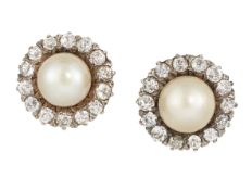 A PAIR OF NATURAL SALTWATER PEARL AND DIAMOND EARSTUDS