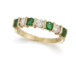 AN 18CT EMERALD AND DIAMOND HALF ETERNITY RING