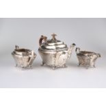 A GEORGE V SILVER THREE-PIECE TEA SERVICE, by John & William F Deakin