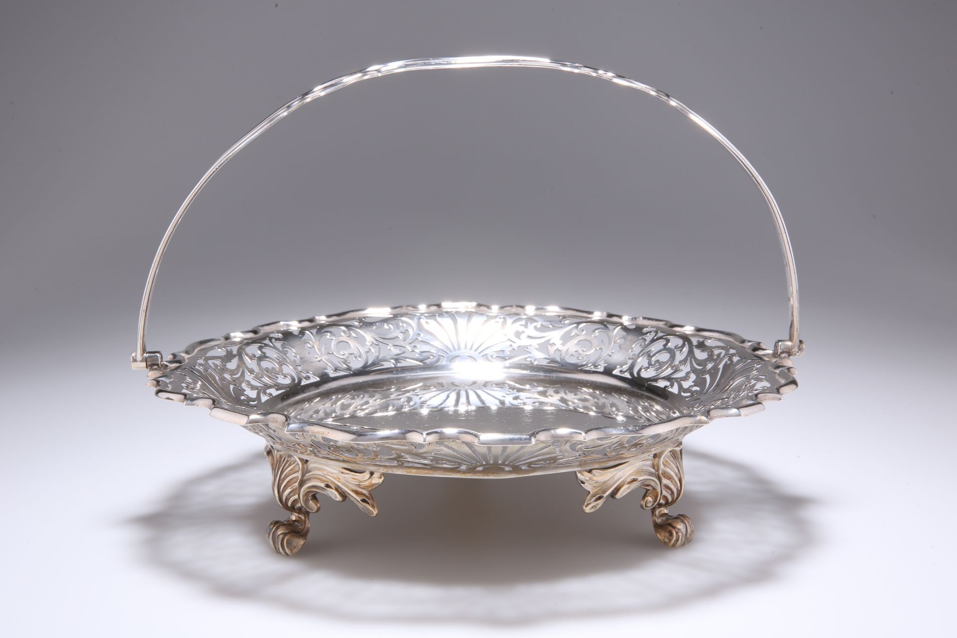 A GEORGE V SILVER CAKE STAND, by Walker & Hall Sheffield 1926, of circular form with pie crust